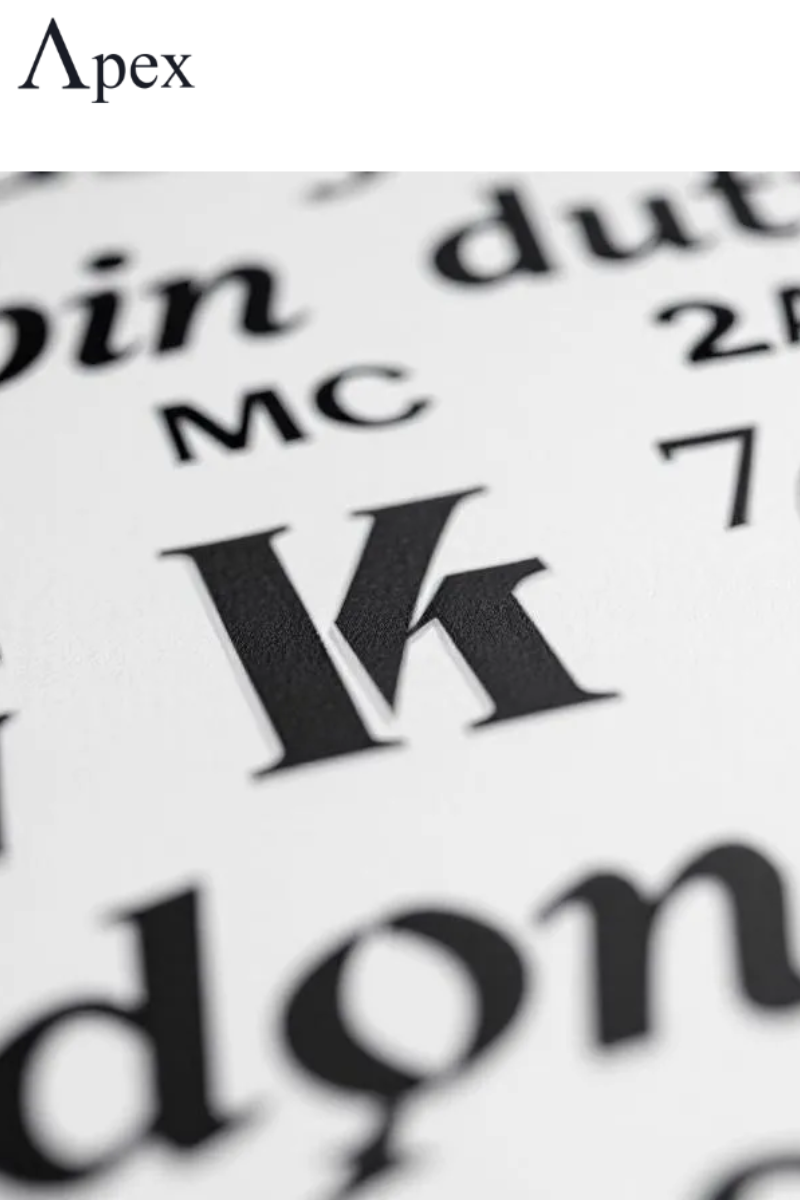 Close-up of bold and serif letters on a typography sheet